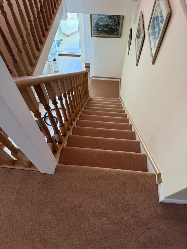 Terracotta carpet fitted on stairs and a landing